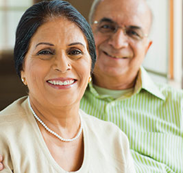 A couple smiling. Links to Gifts of Life Insurance